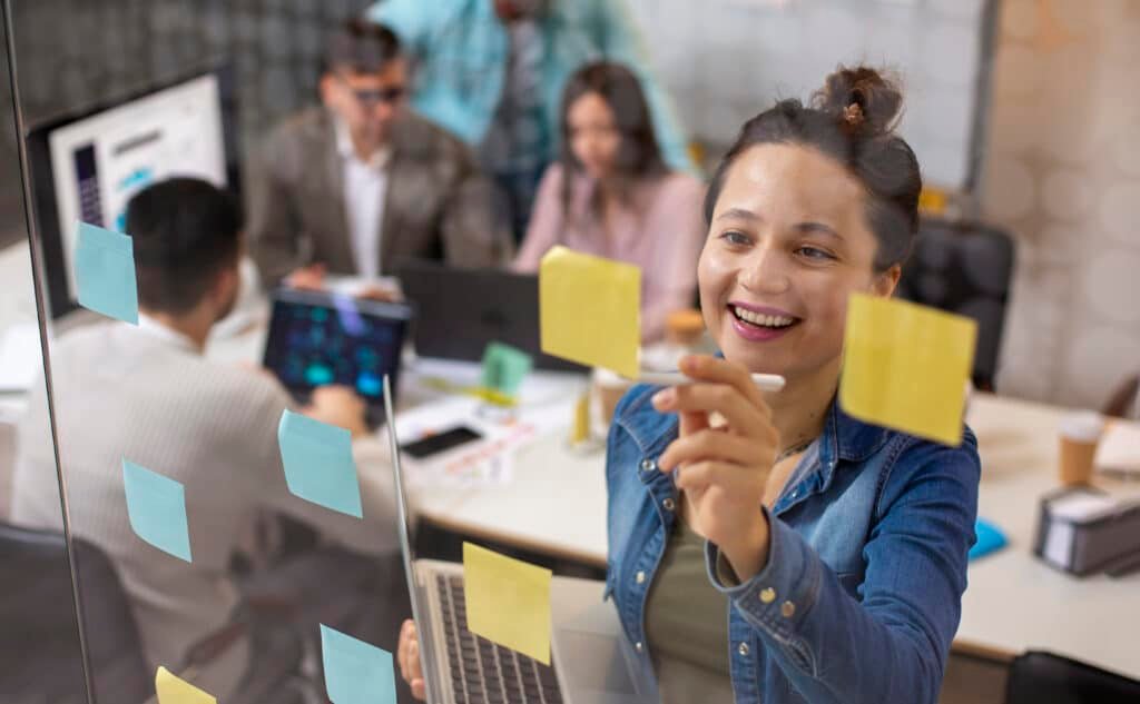 A dynamic C-suite executive team in a meeting, highlighting the roles of CTO, CPO, and other emerging leadership positions.